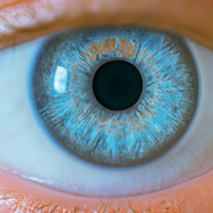 A close-up of an eye with a light blue circle around the dark circles.
