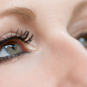 A close-up of a pair of eyes with mascara applied to the lower lashes.