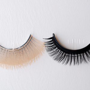 A close-up of two different pairs of false eyelashes side-by-side.