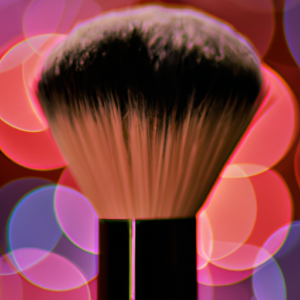 A glowing makeup brush with a glowing background.